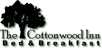 Logo for The Cottonwood Inn Bed & Breakfast featuring a tree silhouette.